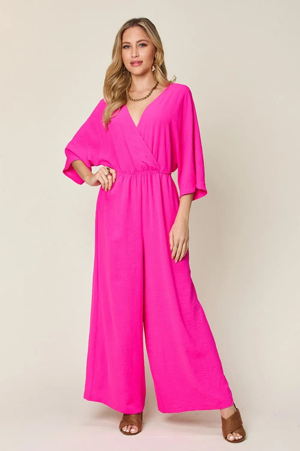 Double Take Full Size Surplice Wide Leg Jumpsuit with Pockets | Nikki &amp; Co. Boutique