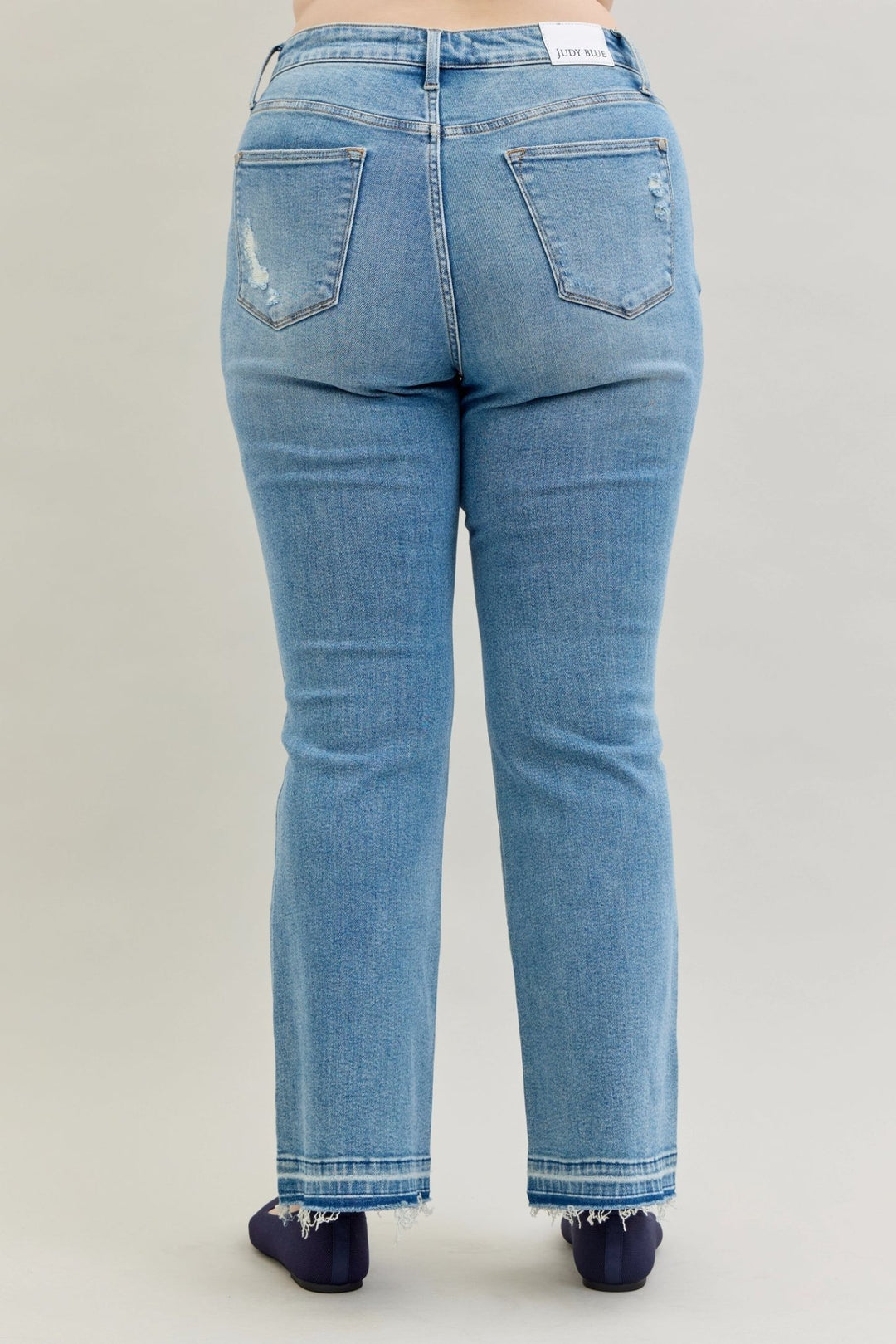 Judy Blue Jeans (NP) - Mid Rise Distressed Release Hem Boot Cut | Nikki &amp; Co. Boutique