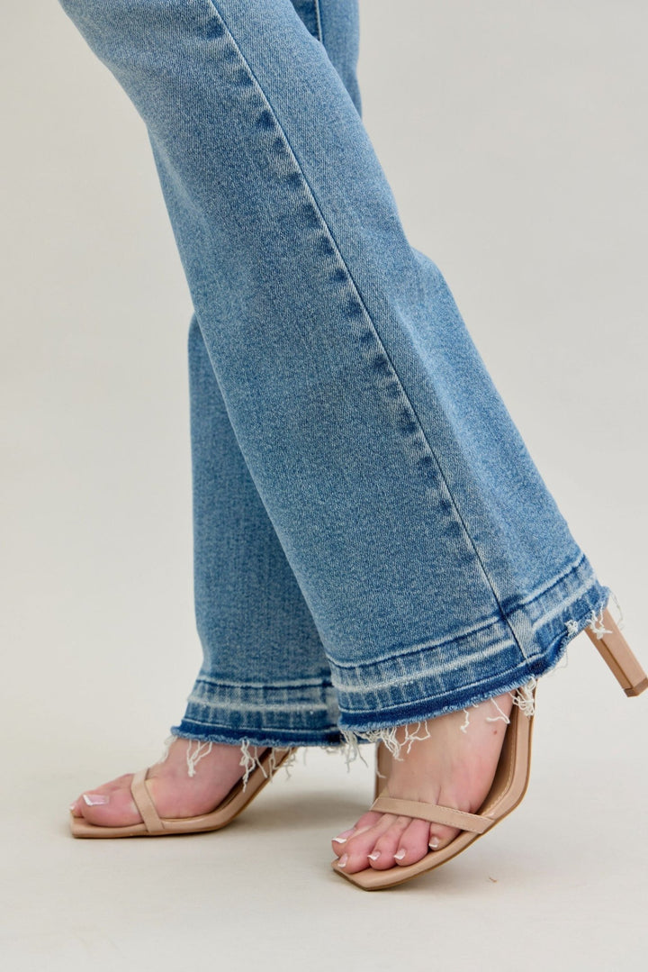 Judy Blue Jeans (NP) - Mid Rise Distressed Release Hem Boot Cut | Nikki &amp; Co. Boutique