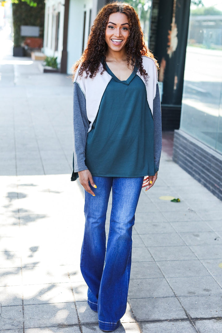 Stand Out Hunter Green V Neck Raglan Color Block Outseam Top | Nikki &amp; Co. Boutique