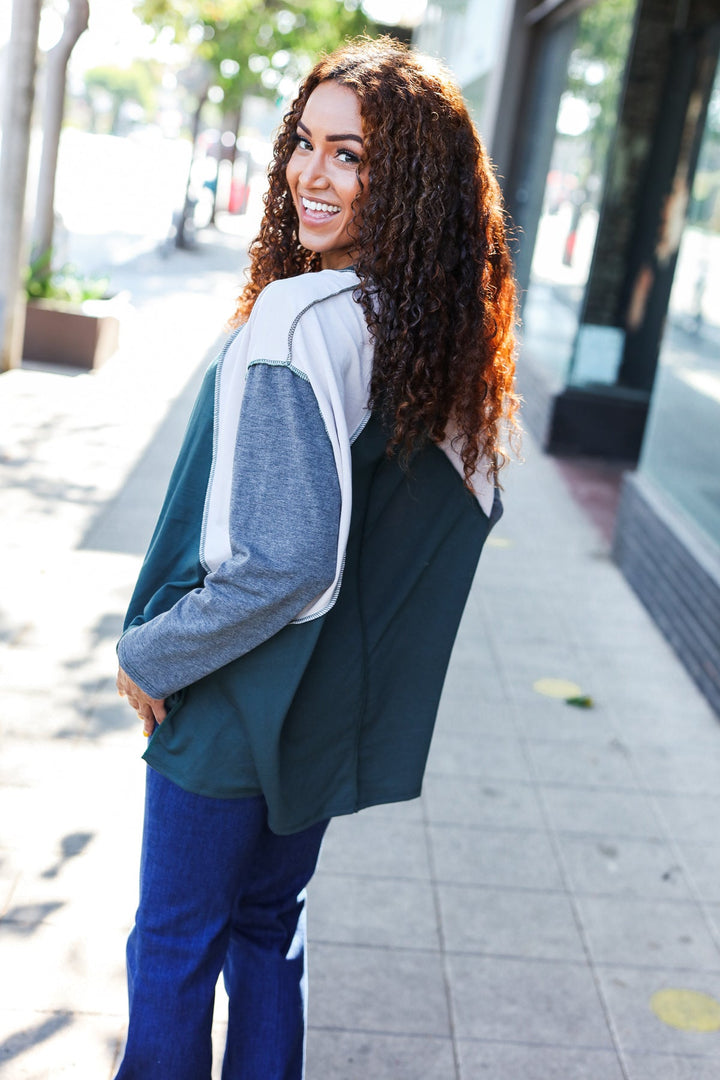 Stand Out Hunter Green V Neck Raglan Color Block Outseam Top | Nikki &amp; Co. Boutique