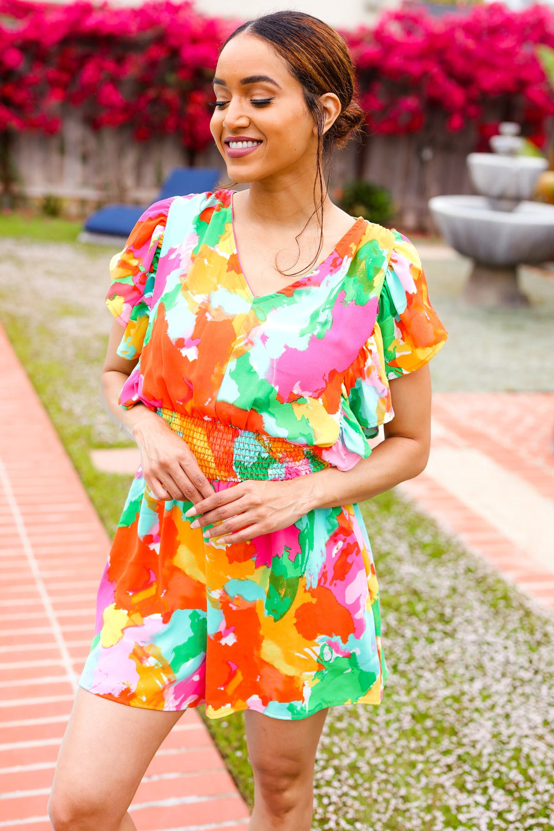 Under The Sun Abstract Floral Smocked Waist V Neck Flutter Sleeve Romper | Nikki &amp; Co. Boutique