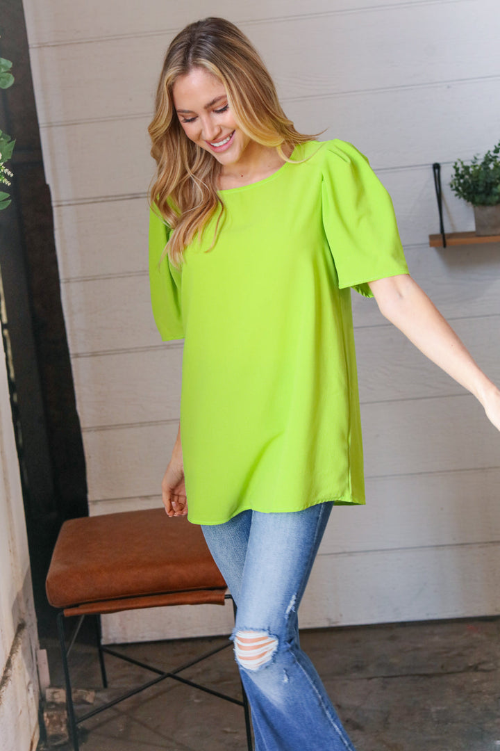 Neon Green Round Neck Puff Sleeve Crepe Tops | Nikki &amp; Co. Boutique