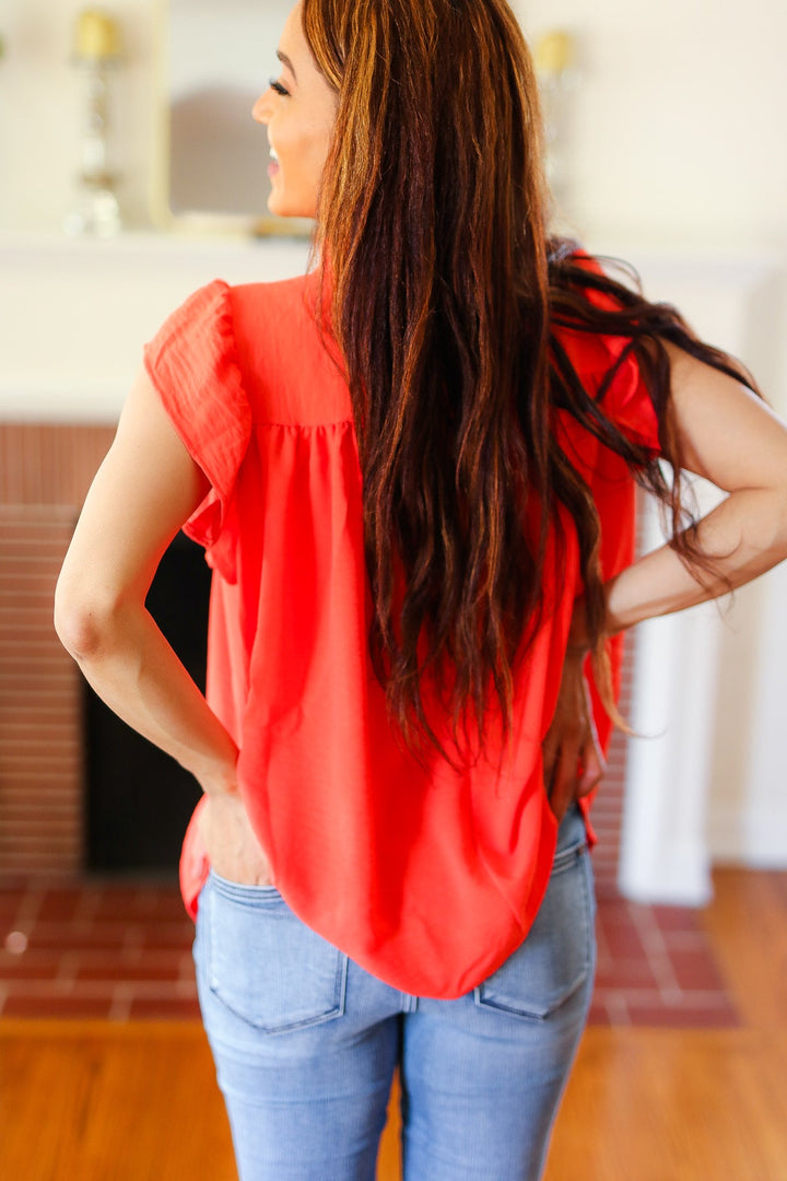 Red-Orange Mock Neck Flutter Sleeve Tops | Nikki &amp; Co. Boutique