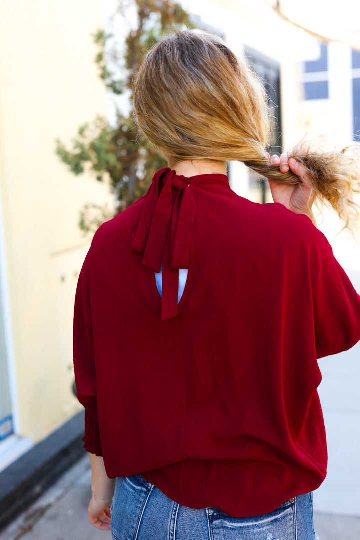Bold Dreams Wine Smocked Three Quarter Sleeve Tie Back Tops | Nikki &amp; Co. Boutique