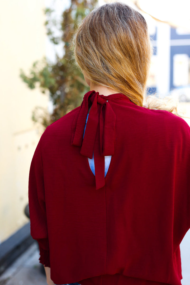 Bold Dreams Wine Smocked Three Quarter Sleeve Tie Back Tops | Nikki &amp; Co. Boutique