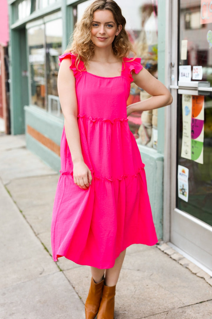 Lots To Love Fuchsia Smocked Flutter Sleeve Tiered Midi Dress | Nikki &amp; Co. Boutique