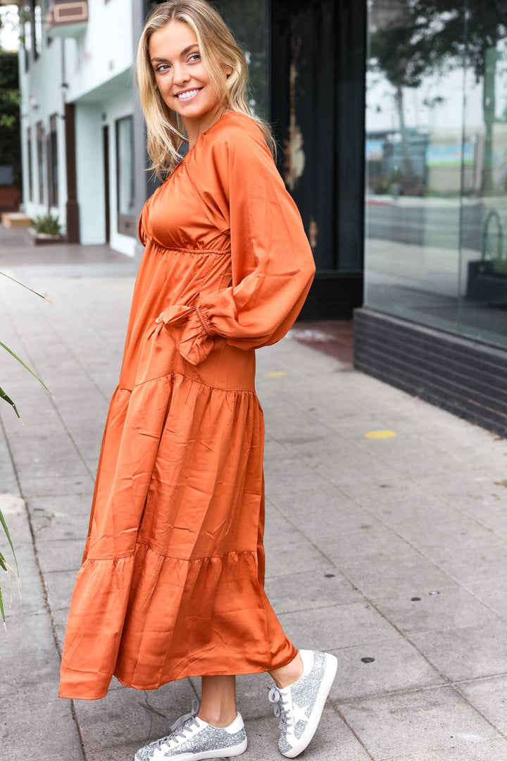 Elegant Rust Elastic V Neck Tiered Satin Maxi Dress | Nikki &amp; Co. Boutique