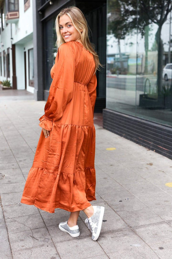 Elegant Rust Elastic V Neck Tiered Satin Maxi Dress | Nikki &amp; Co. Boutique