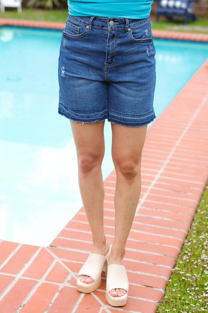 Indigo Blue High Rise Release Hem Distressed Jean Shorts - Nikki &amp; Co. Boutique