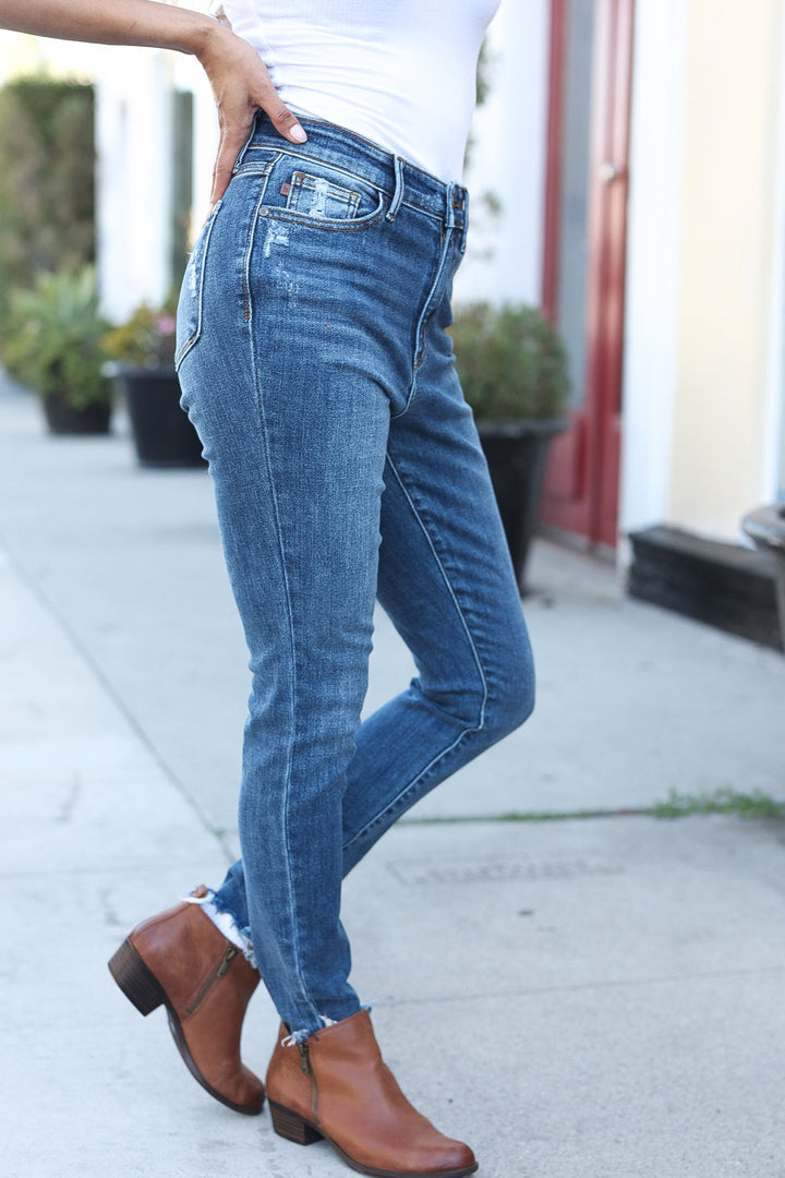 Judy Blue Dark Wash Mid Rise Minimum Distressed Straight Leg Jeans | Nikki &amp; Co. Boutique