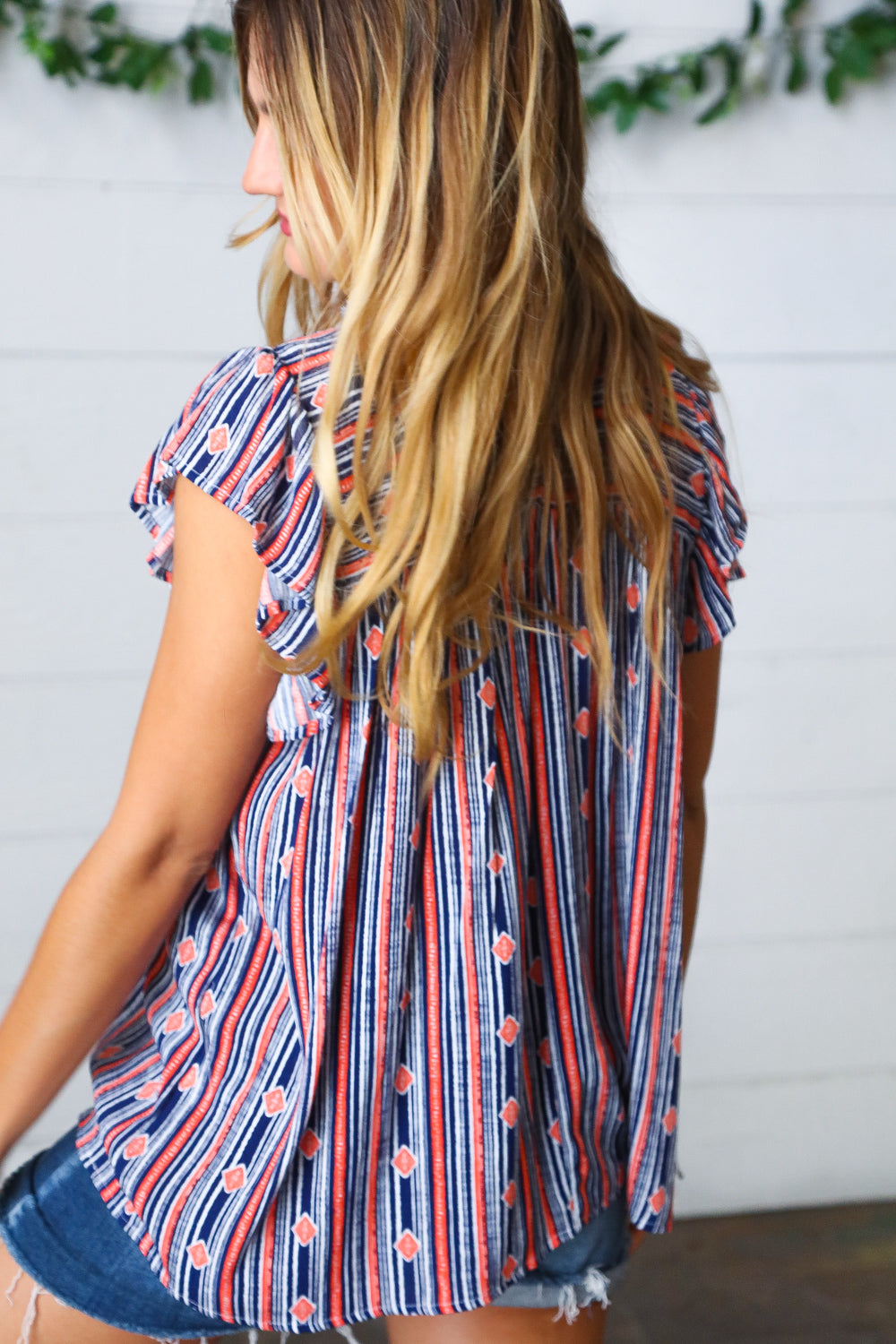 Navy &amp; Orange Boho Stripe Flutter Sleeve Tops | Nikki &amp; Co. Boutique