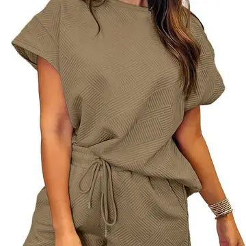 Woman wearing a green ribbed knit outfit on a white background