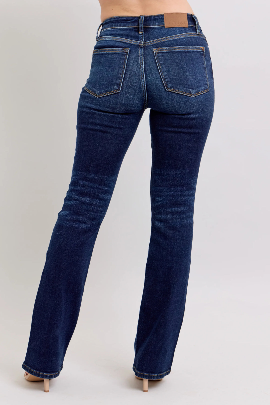 Blue jeans on a plain background