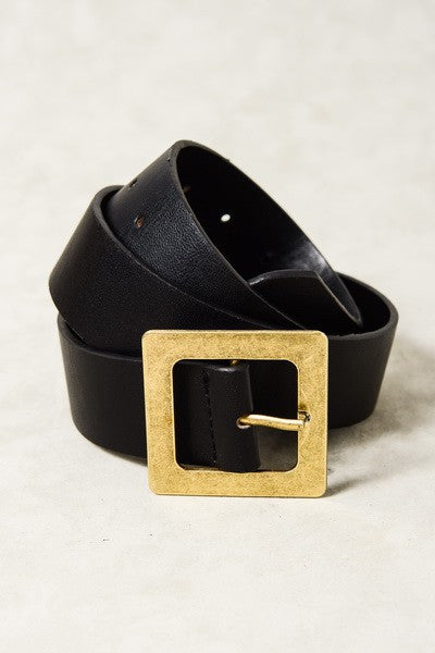 Black belt with a gold square buckle on a light gray background