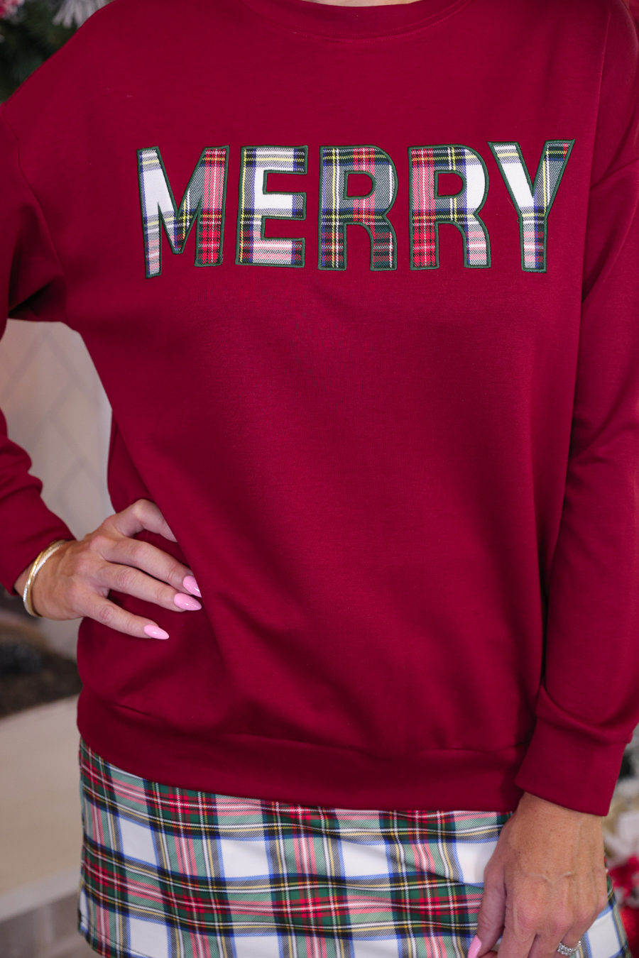 Red sweatshirt with plaid text &
