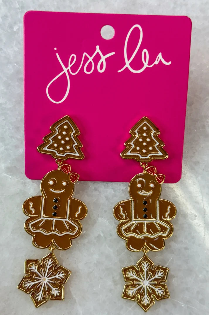 A pair of gingerbread man earrings.