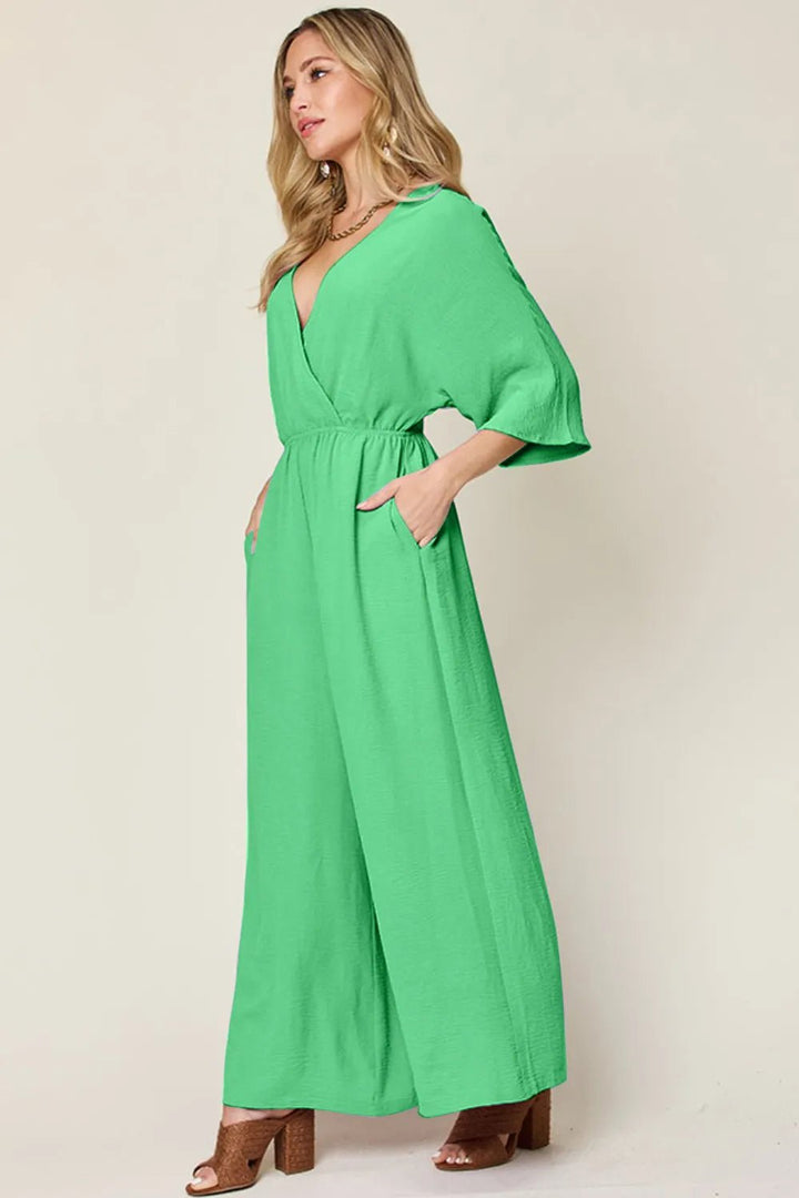 Double Take Full Size Surplice Wide Leg Jumpsuit with Pockets | Nikki &amp; Co. Boutique