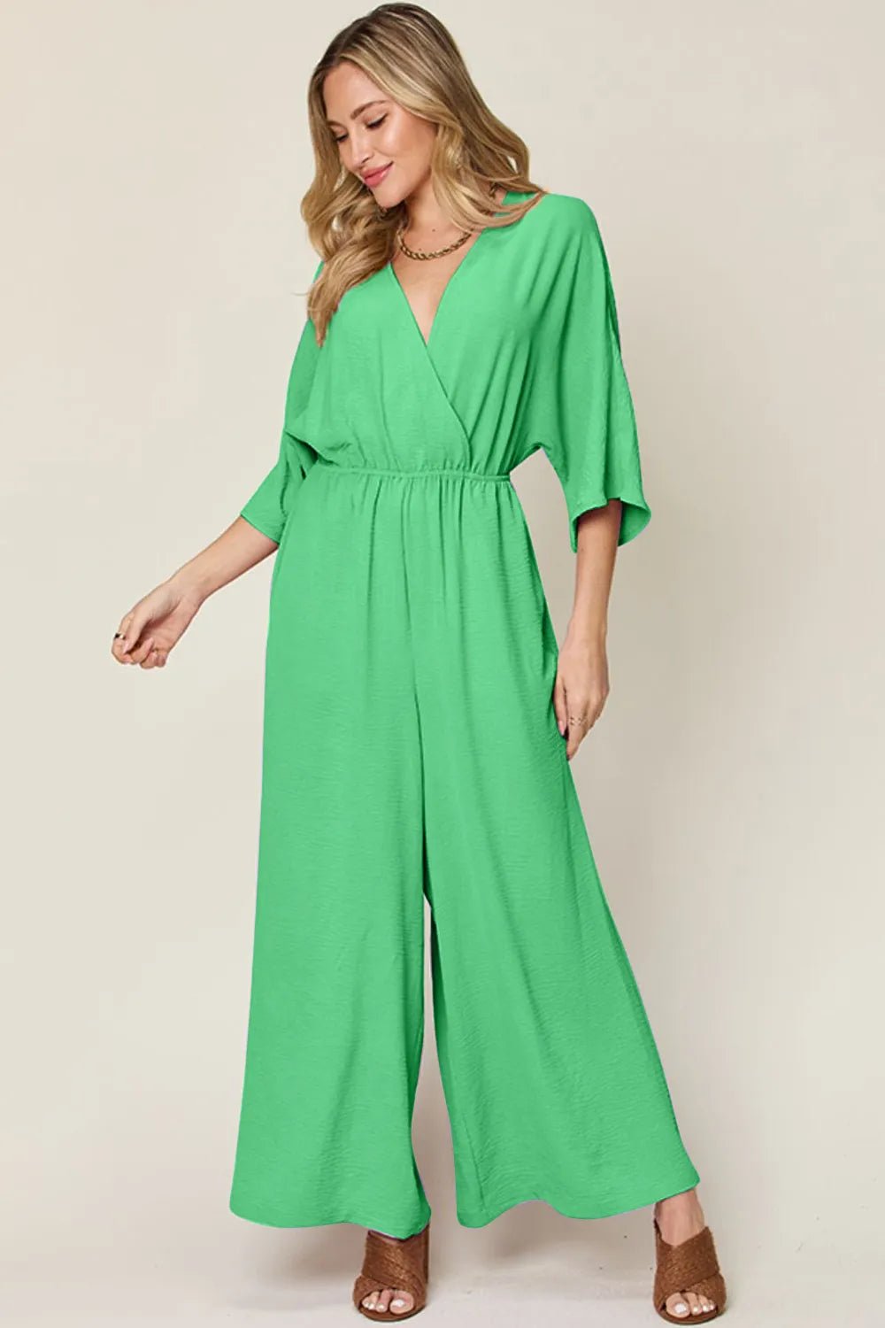 Double Take Full Size Surplice Wide Leg Jumpsuit with Pockets | Nikki &amp; Co. Boutique