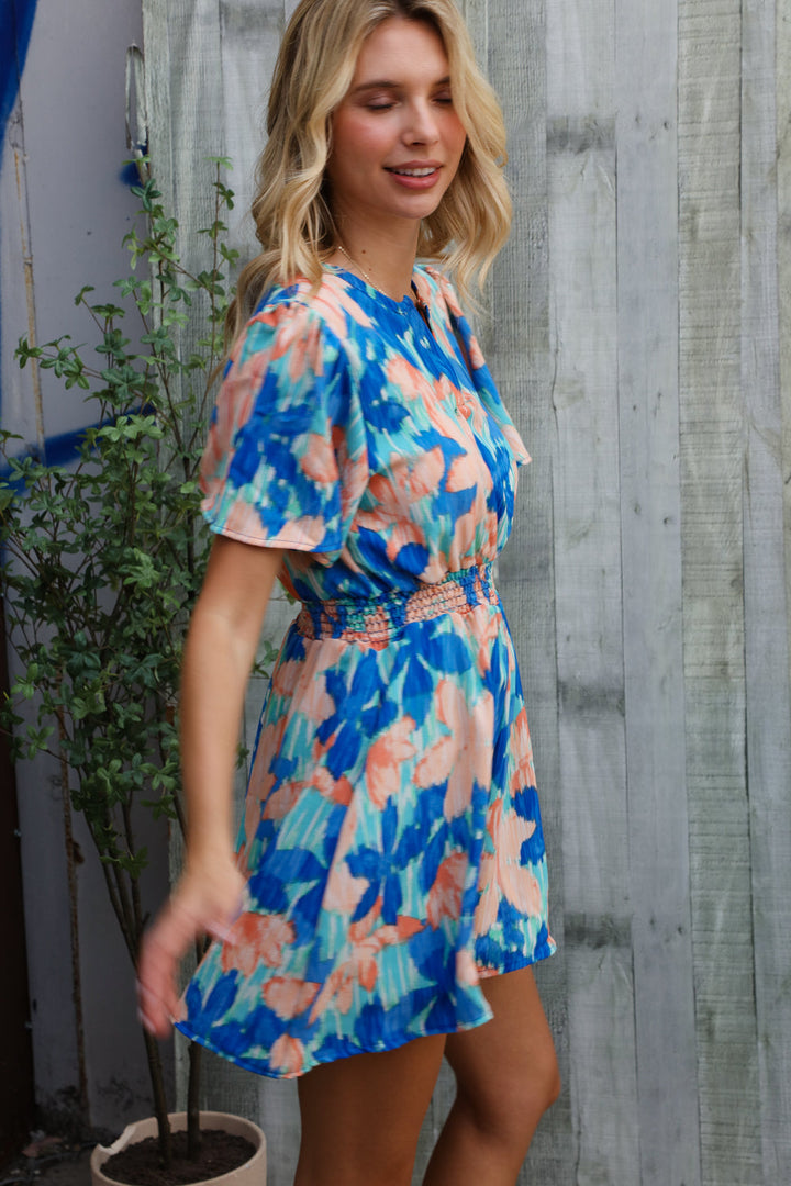 Feeling Bold Turquoise Floral Smocked Waist Flutter Sleeve Romper | Nikki &amp; Co. Boutique