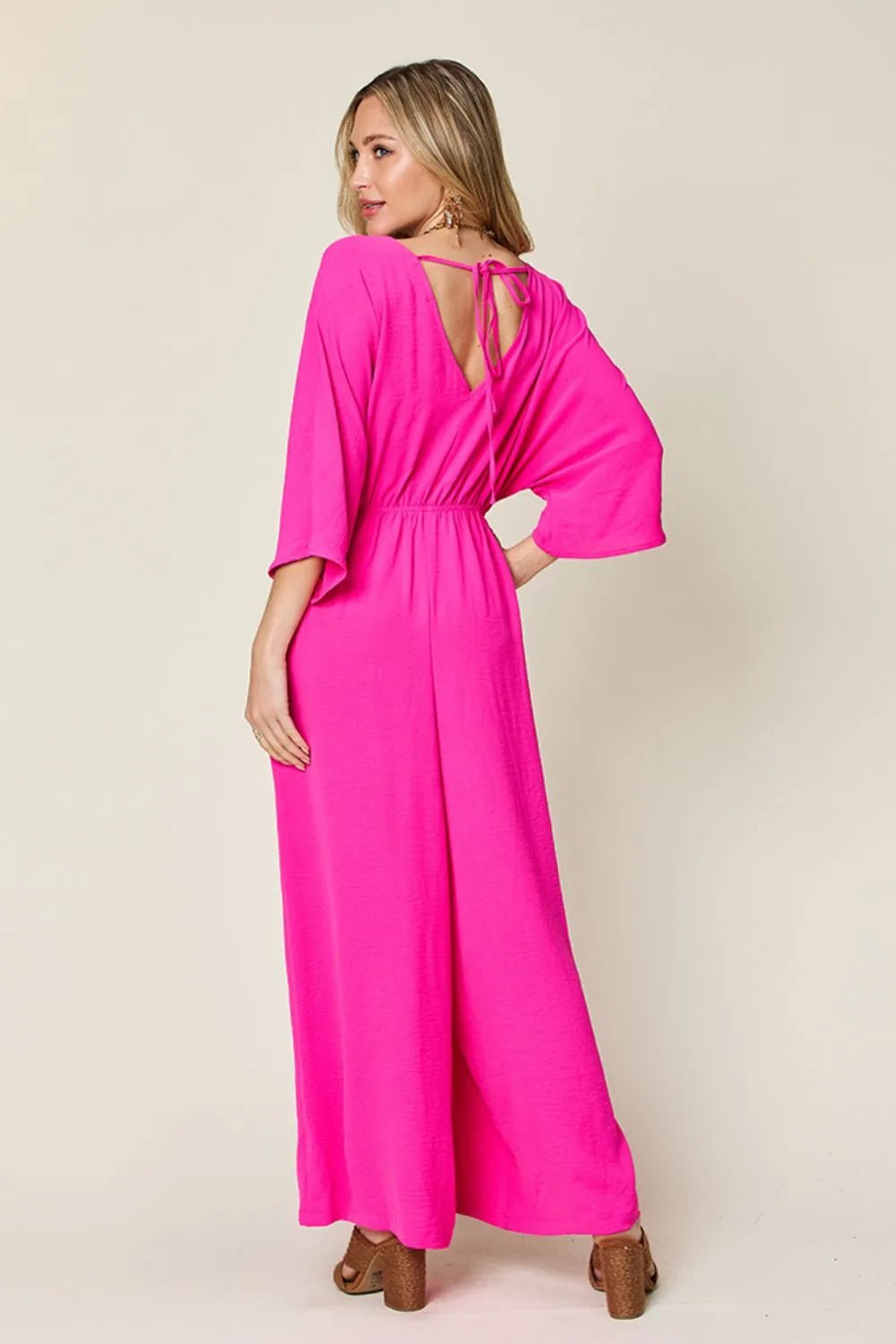 Double Take Full Size Surplice Wide Leg Jumpsuit with Pockets | Nikki &amp; Co. Boutique
