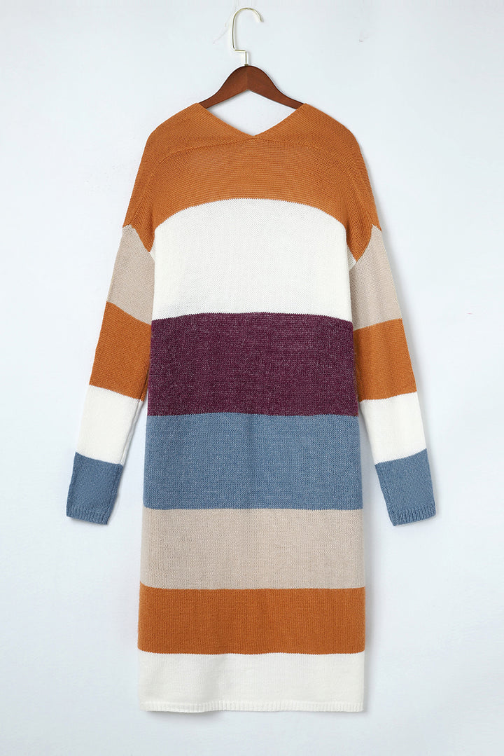 Color-blocked sweater on a hanger against a white background