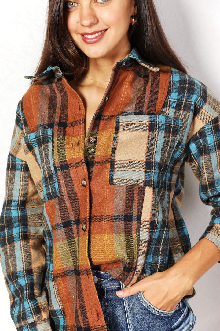Woman wearing a plaid shirt with a neutral background