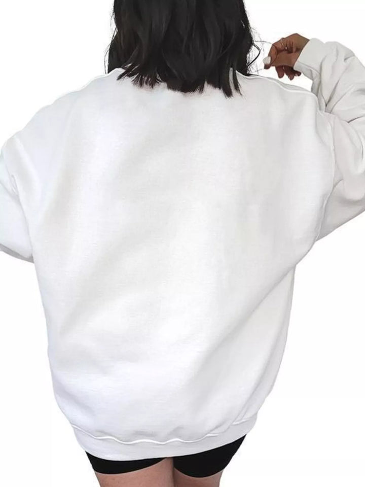 Women wearing white sweatshirt facing the wall