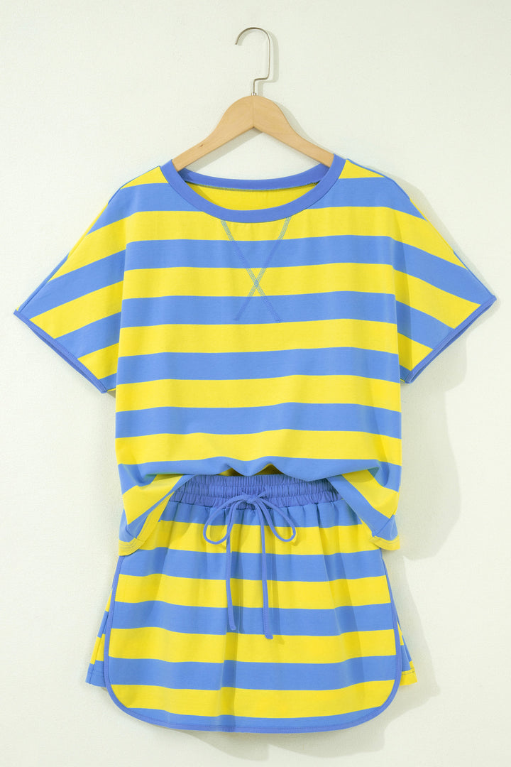 Blue and yellow striped shirt and shorts set on a hanger against a white background