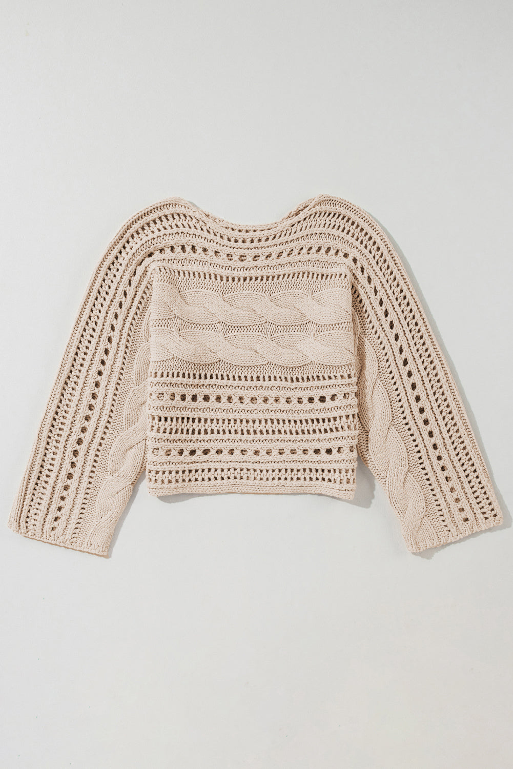 Beige crochet sweater on a light gray background