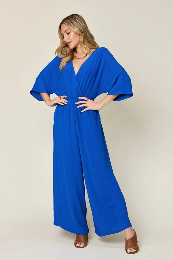Double Take Full Size Surplice Wide Leg Jumpsuit with Pockets | Nikki &amp; Co. Boutique