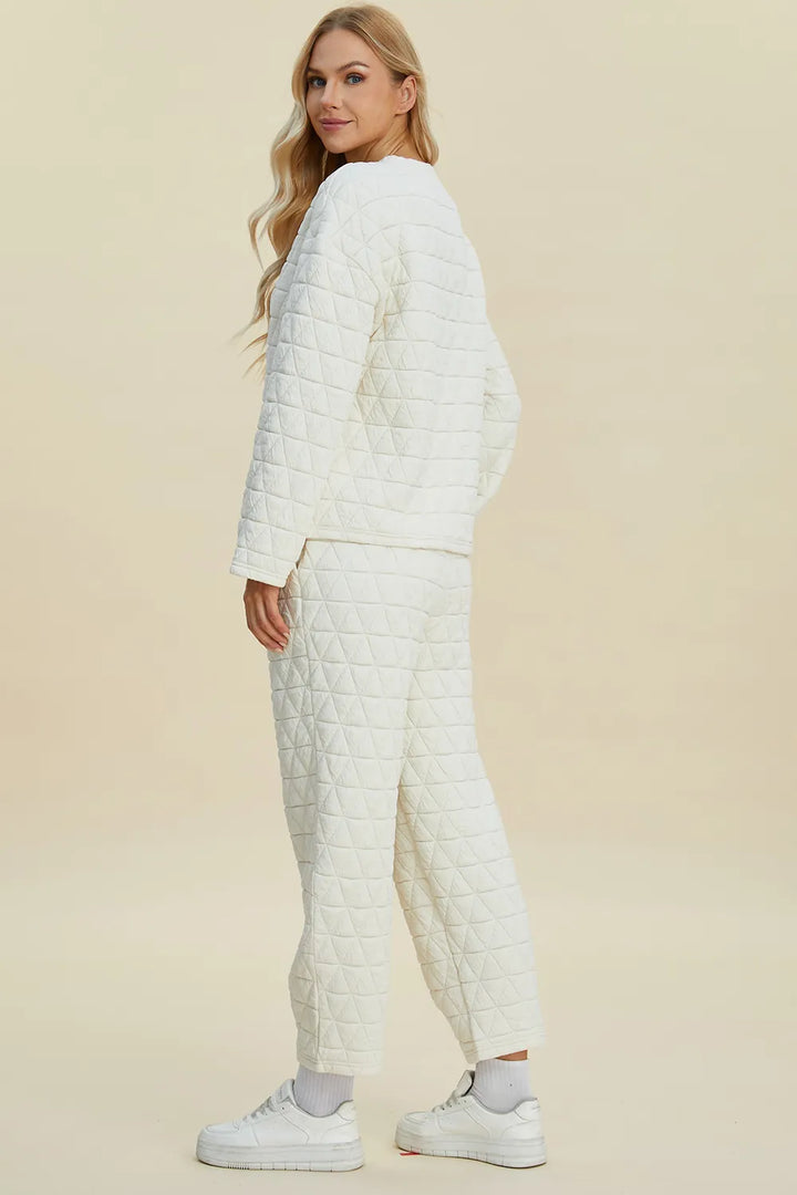 Woman wearing a white quilted outfit on a beige background