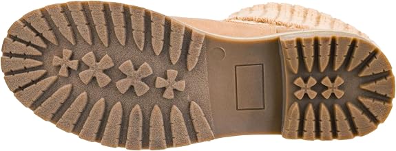 Close-up of the brown rubber outsole of a tan boot, showing tread patterns and a molded square logo area.