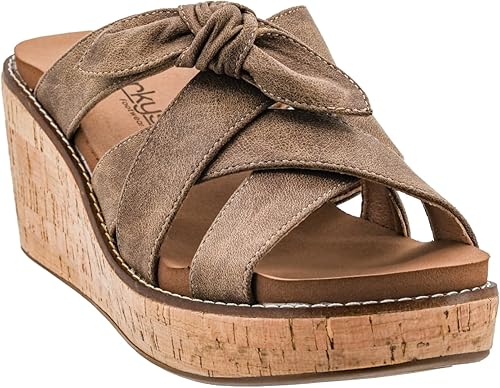 Brown wedge sandal with cork sole on a white background