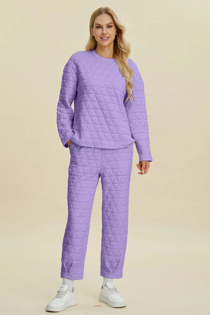 Woman wearing a purple quilted outfit on a beige background