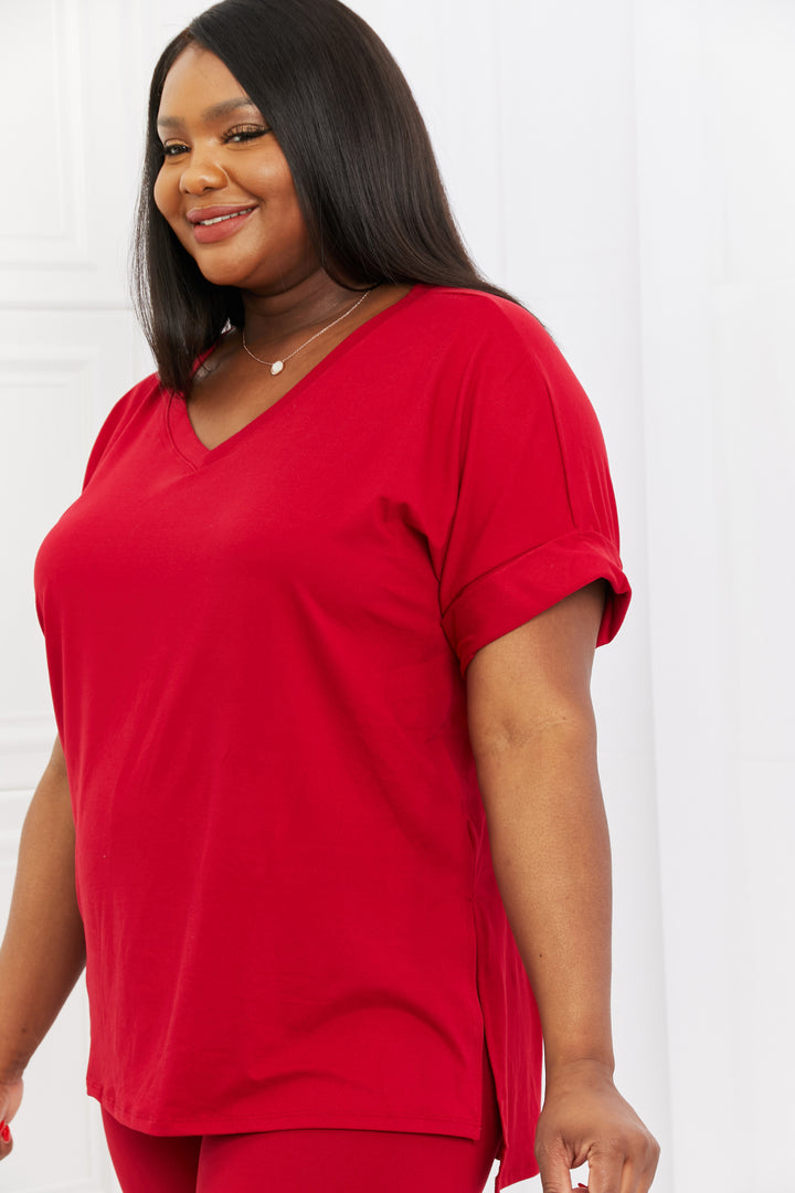 Woman wearing a burgundy outfit against a white background