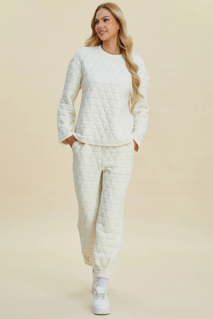 Woman wearing a white quilted outfit on a beige background