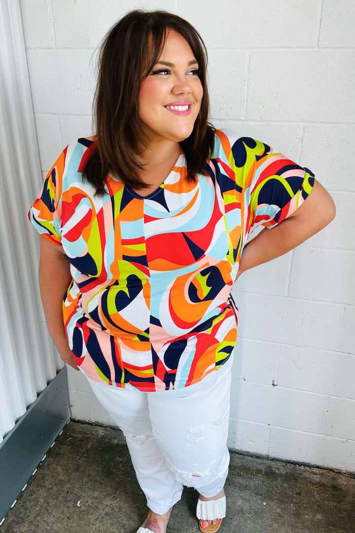 Orange Geometric V Neck Drop Shoulder Tops | Nikki &amp; Co. Boutique