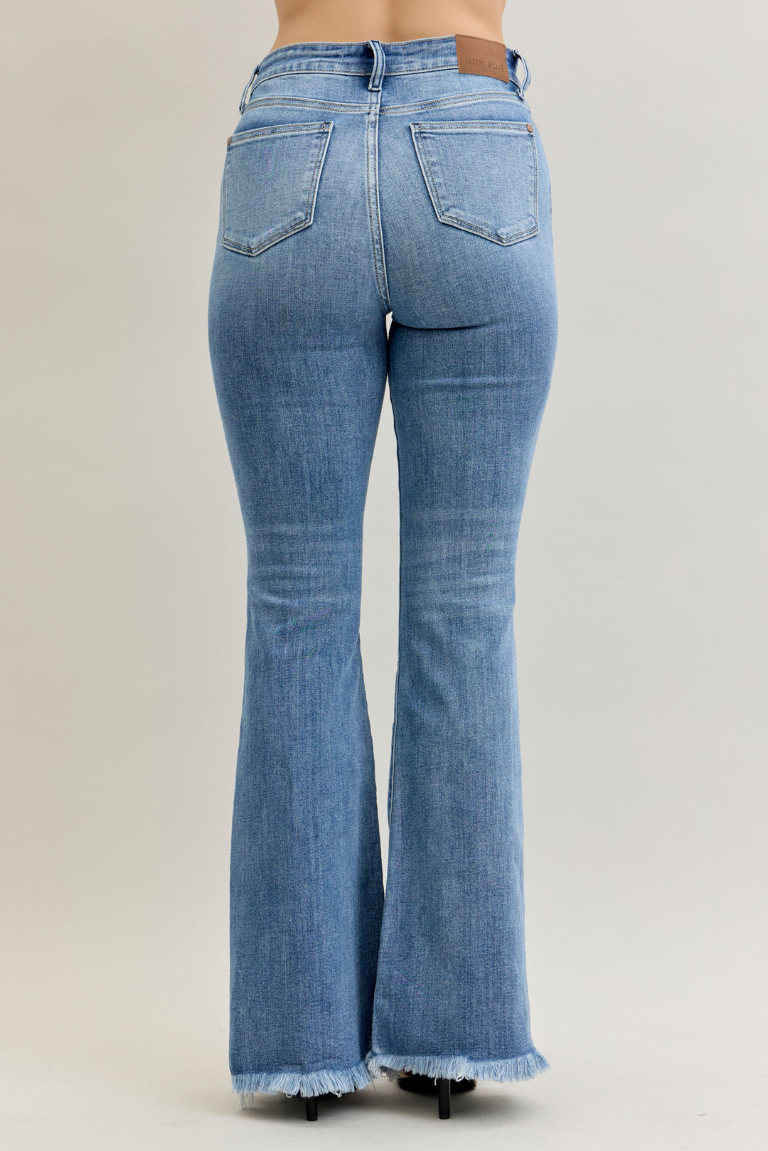 Judy Blue JB82687 high waisted fray hem flare jeans, rear view. Judy Blue Jeans (NP) - High Waisted Fray Hem Flare | Nikki &amp; Co. Boutique