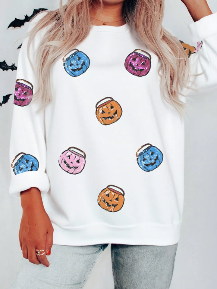 Women wearing a white sweatshirts with blue purple orange and pink small  Halloween buckets