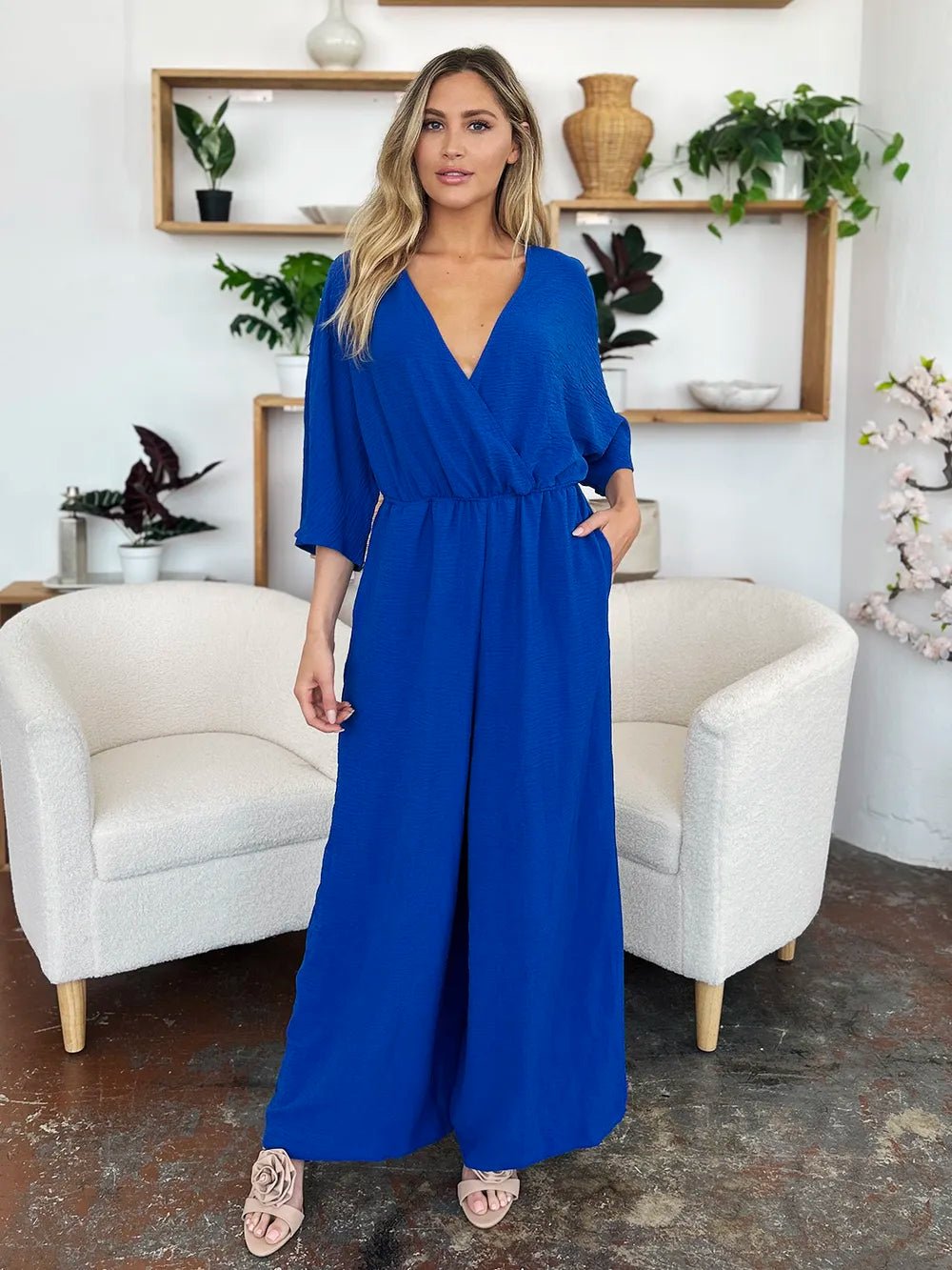 Double Take Full Size Surplice Wide Leg Jumpsuit with Pockets | Nikki &amp; Co. Boutique