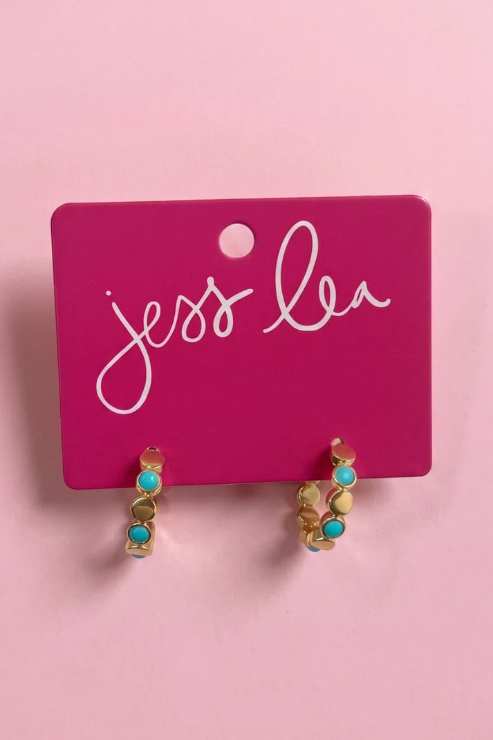 A pair of colorful, small hoop earrings.