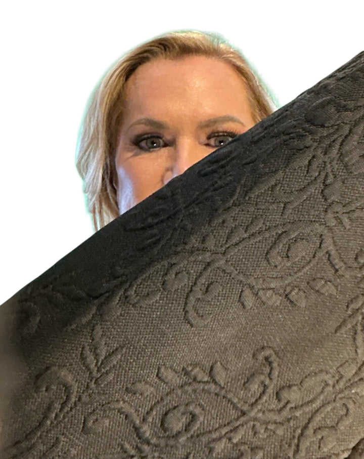 Close up of the black blazer fabric design.