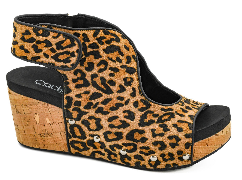 Leopard print wedge sandal with cork sole on a white background