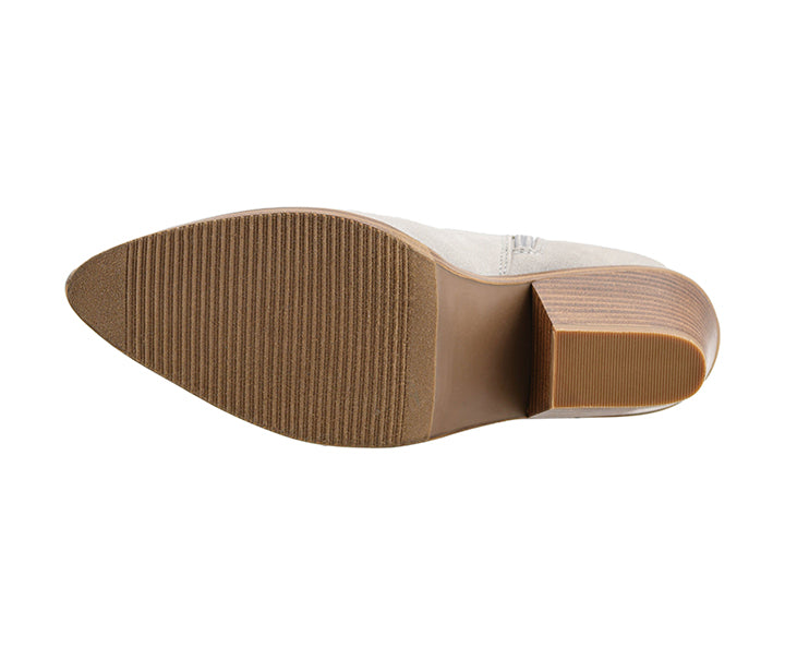 Close-up of a shoe sole with brown tread pattern on a white background