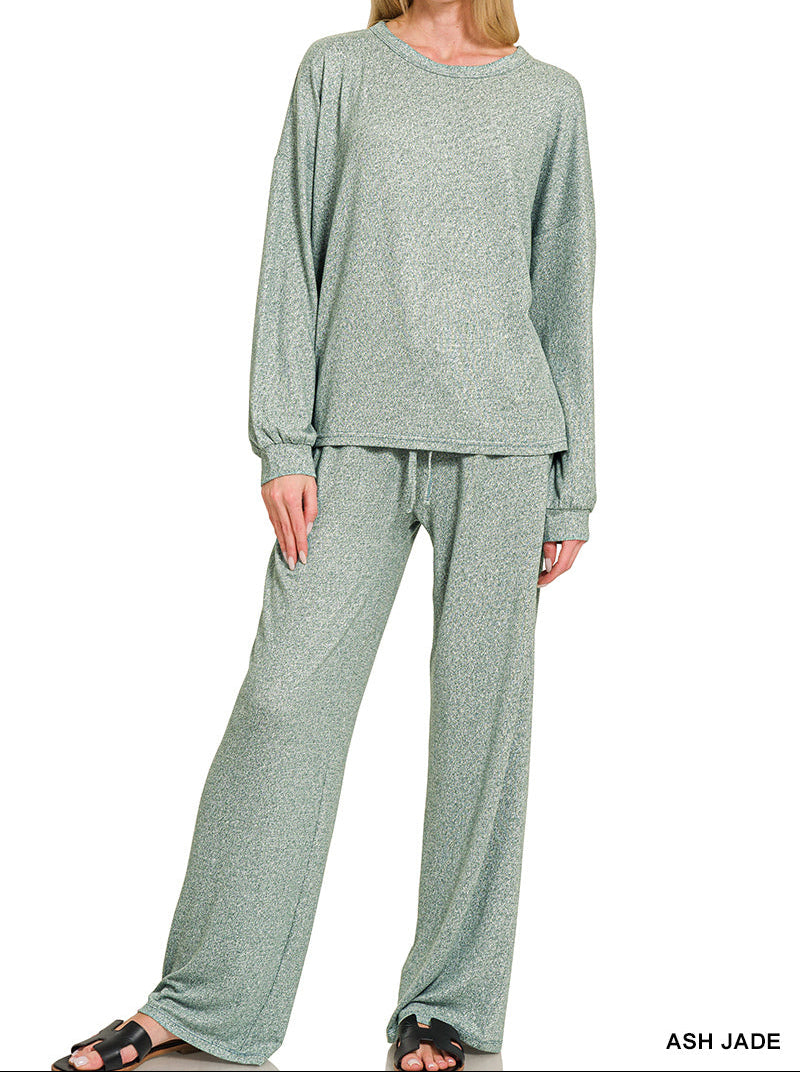 Woman wearing a 2-piece round neck top and drawstring bottom set