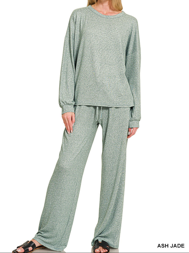 Woman wearing a 2-piece round neck top and drawstring bottom set