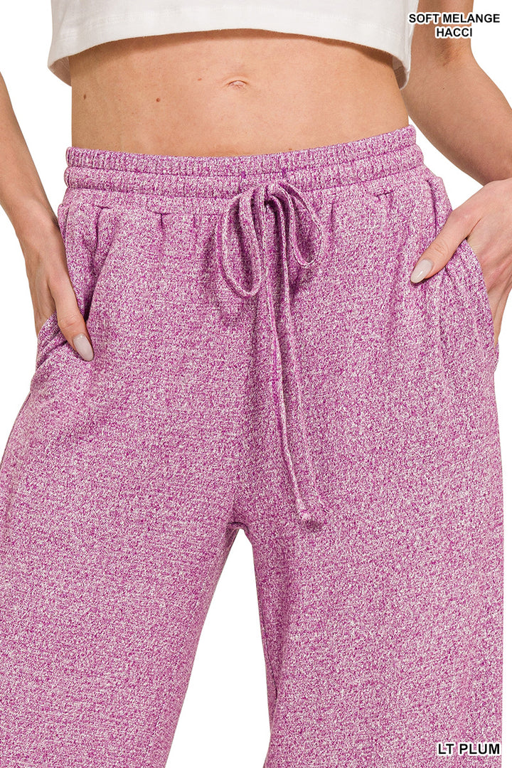 Woman wearing light plum pants