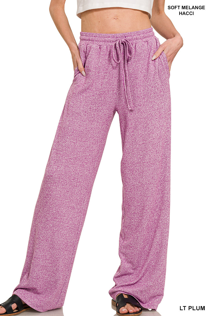 Woman wearing light plum drawstring pants