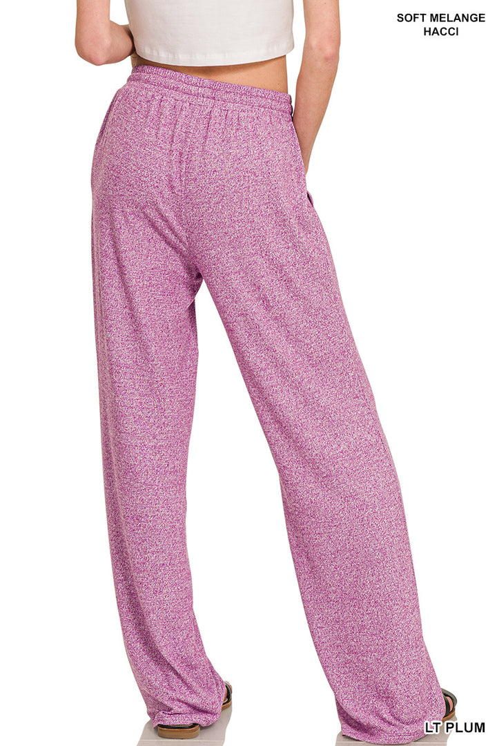 Woman wearing light plum pants